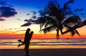 Couple posing against the scenic beauty of Goa